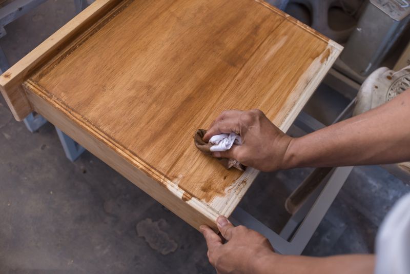 Expert applying refinishing coating